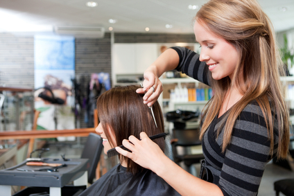 Hairdresser Cutting Client's Hair