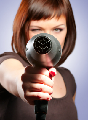 Woman with hairdryer